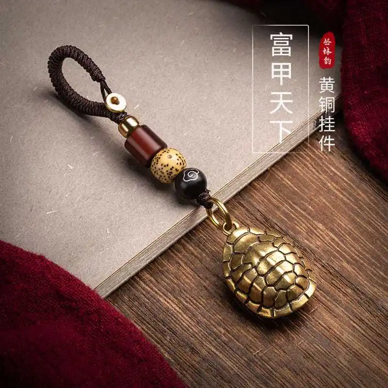 

Fugui world brass turtle shell back cloud hand handle car keychain pendant ancient style high -end men's tide accessories hangin