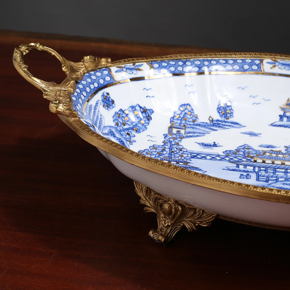 

Creative Blue And White Porcelain Fruit Plate With Golden Copper Stand Ceramic Tableware