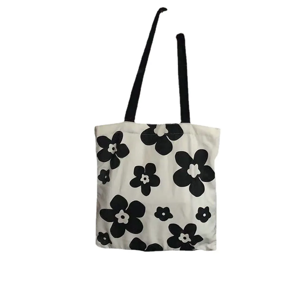 INS Canvas Bag Black and White Hyunya Flower Female Student Fashion Versatile Shoulder Bag Large Capacity Shopping Bag