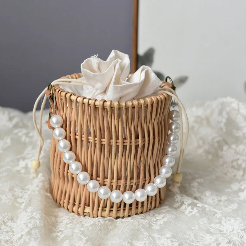 

Rattan Bag Basket Portable Pearl Tie Wicker Woven Bag Cosmetic Bag Pendant Bag Net Red Storage Basket