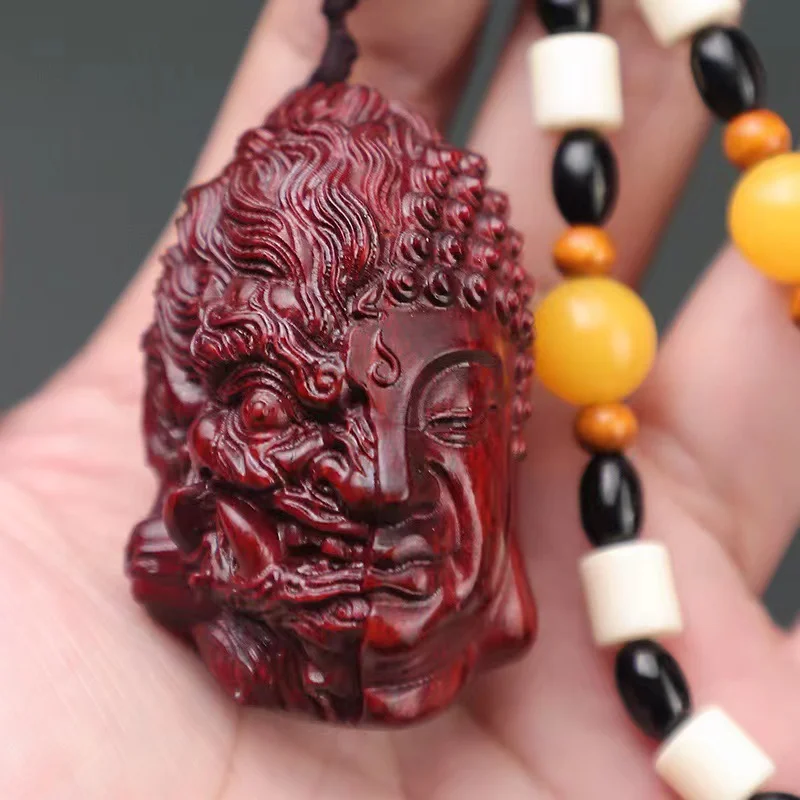 

Small leaf rosewood good and evil Buddha demon between the hand piece play boxwood pendant mahogany wood carvings