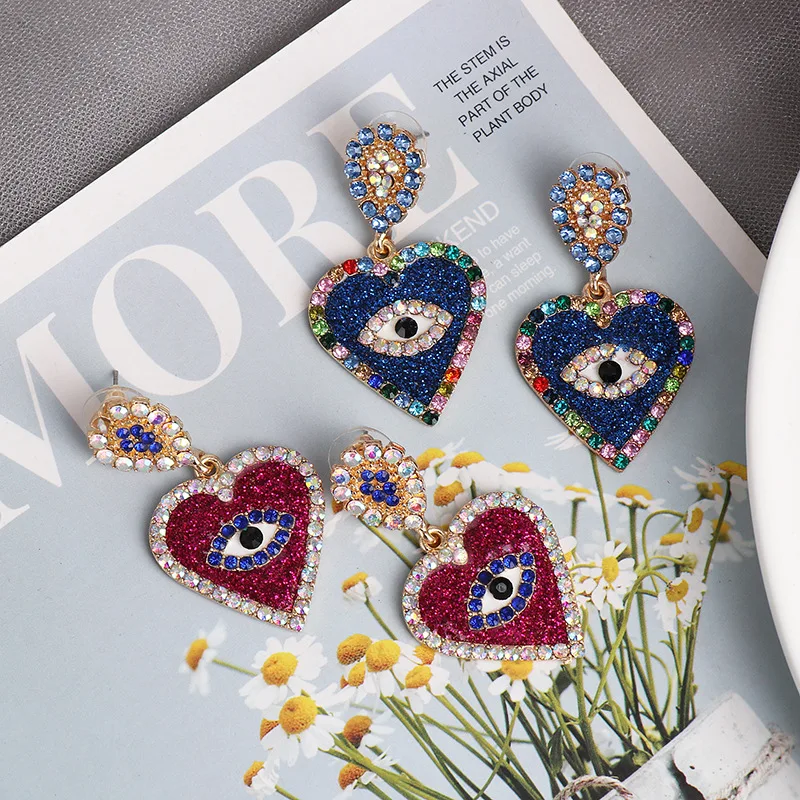 Стильные яркие серьги с ярким Цирконом