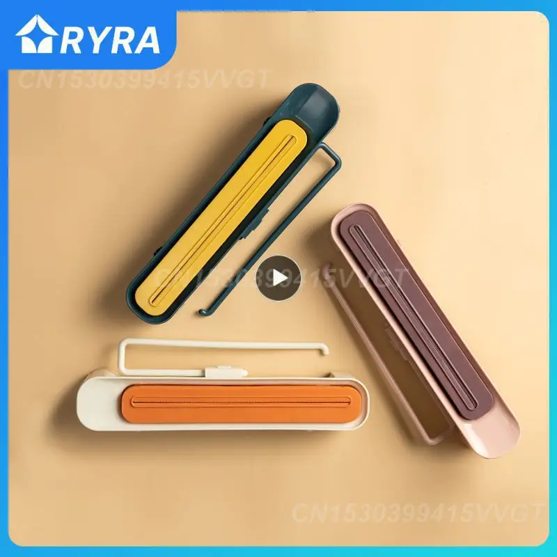 

Newest Plastic film cutter suction cup wall mounted plastic film cutting box kitchen divider storage cutter