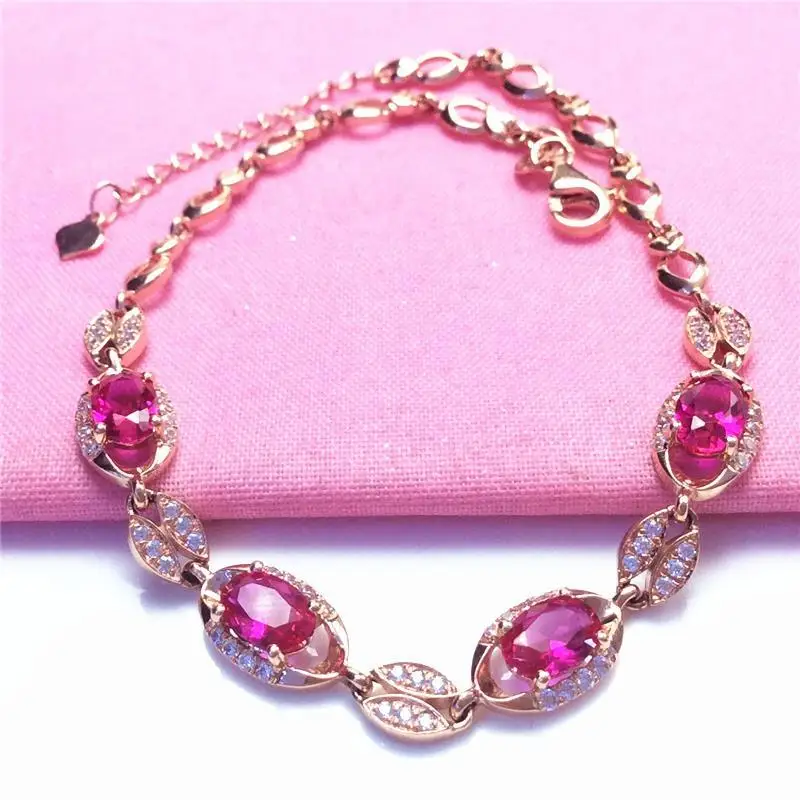 

Женский браслет из розового золота 585 пробы с красным камнем