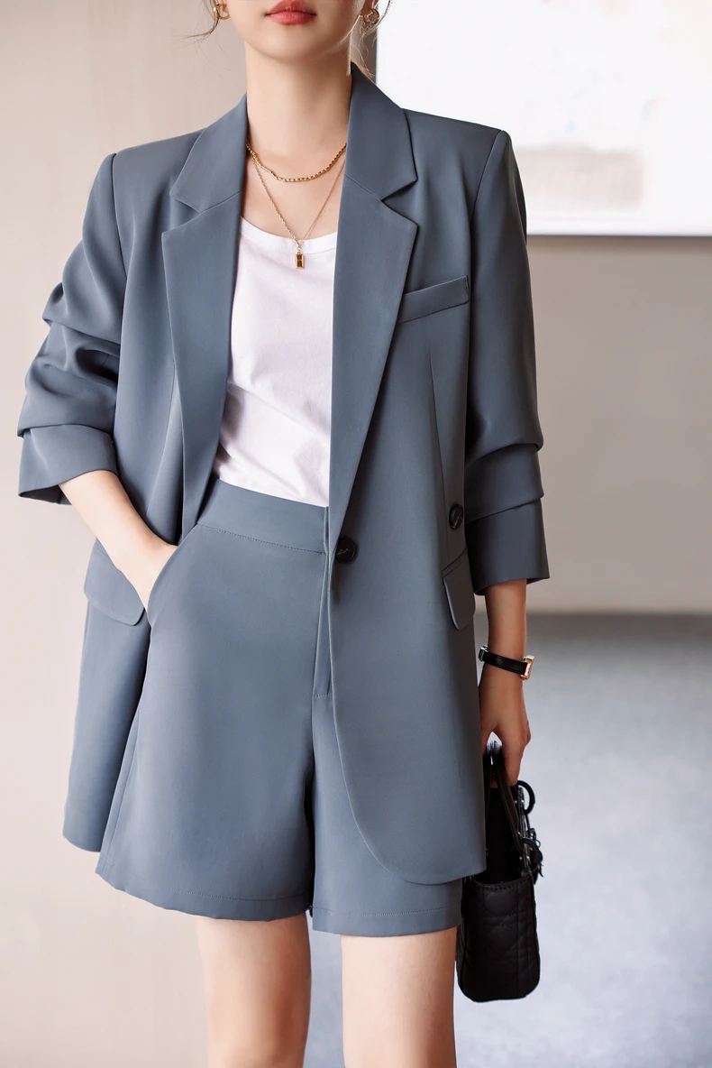 Tailored shorts with a blazer, chic summer work suit