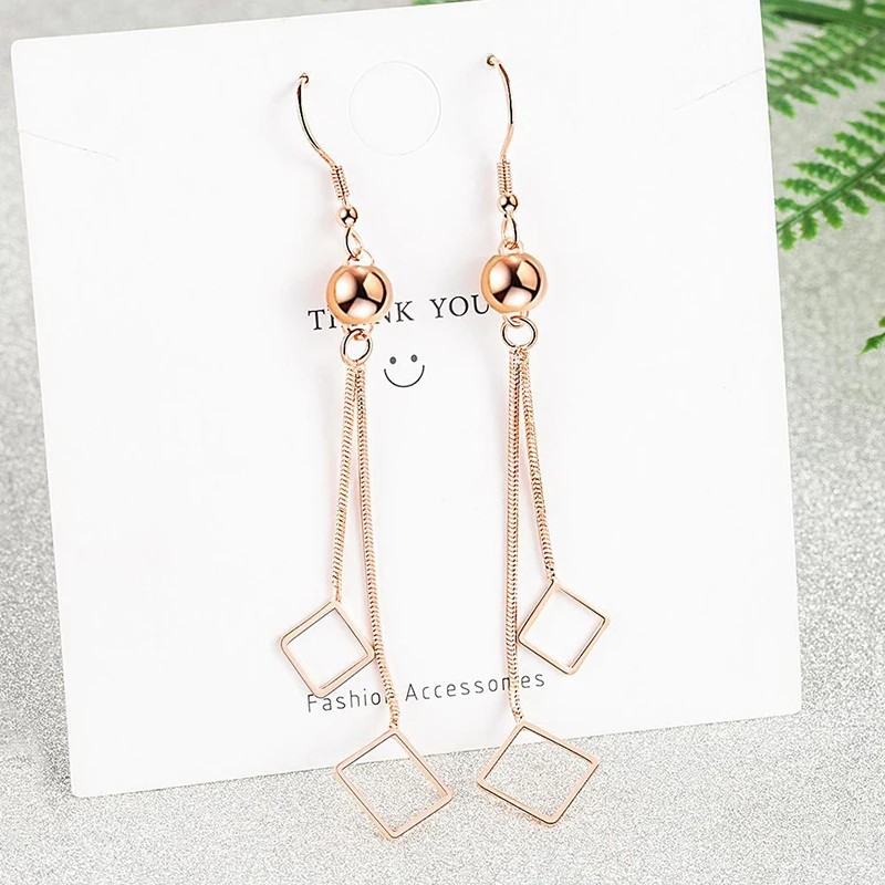 Длинные квадратные двухслойные серьги с кисточками розового золота и