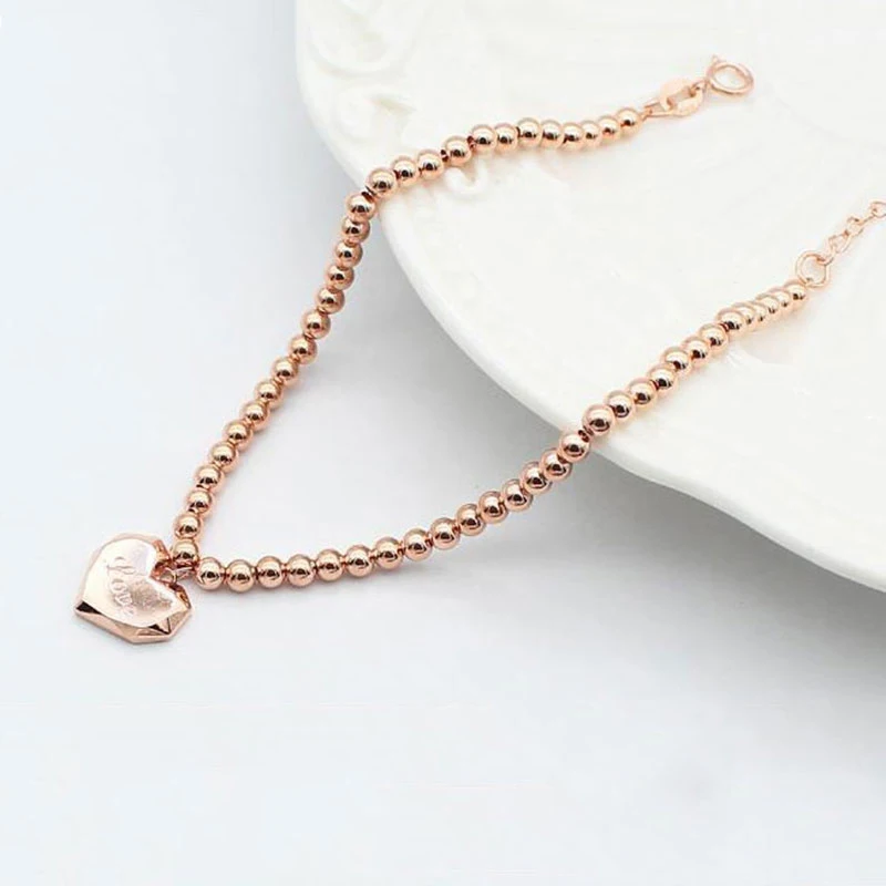 Женский браслет из розового золота 585 пробы с круглыми бусинами