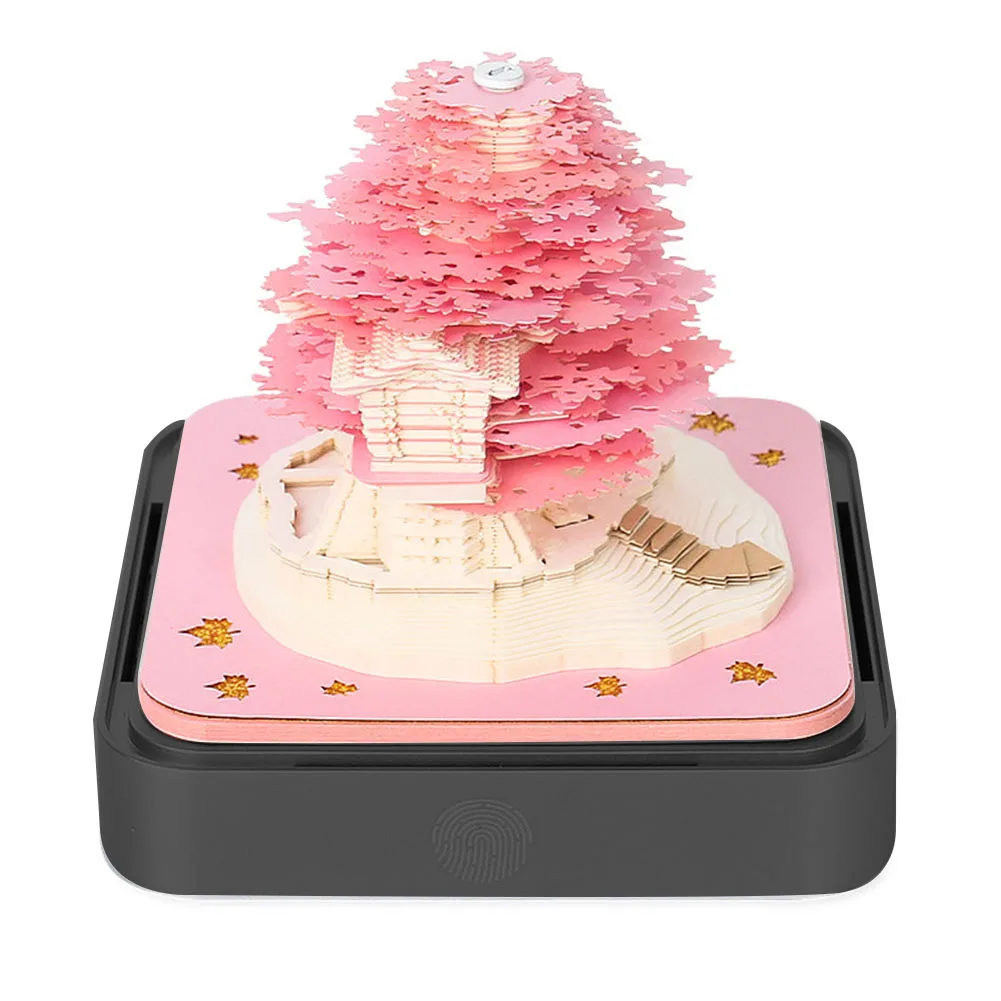 

Captivating 2024 calendar ornament tree shaped paper sculpture tear off pages lights for a mesmerizing effect