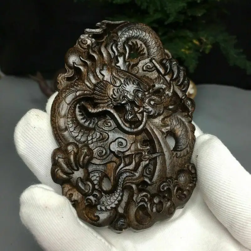 

Chinese Natural Agarwood Hand-Carved Exquisite Dragon Pendant