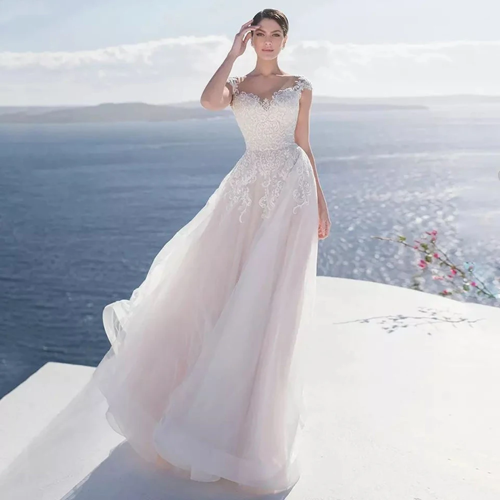 

2022The New Elegant Beautiful Lace Appliques Wedding Dress O-Neck Short Sleeve Backless Bride Gown A-Line Tulle Button Illusion
