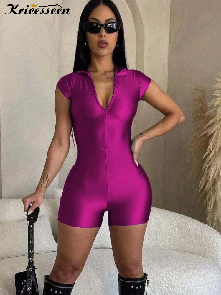 

Kricesseen Shiny Metallic Rompers For Women Short Sleeve Zippers Front Holographic Women Playsuits Sexy Clubwear Rave Outfits