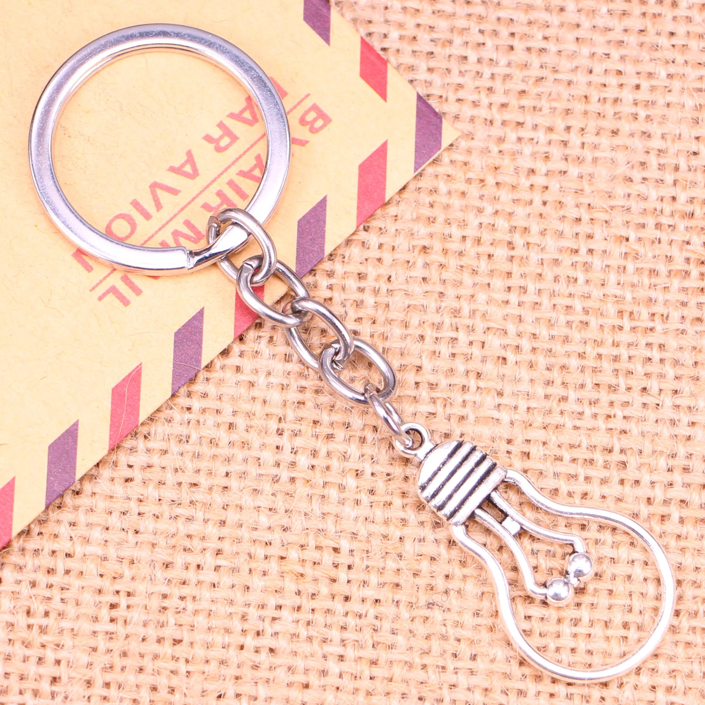 20pcs New Fashion Keychain 19*35 mm light bulb Pendants DIY Men Jewelry Car Key Chain Ring Holder Souvenir For Gift