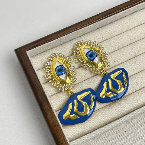 Золотые серьги-капельки с жемчугом и глазами демона