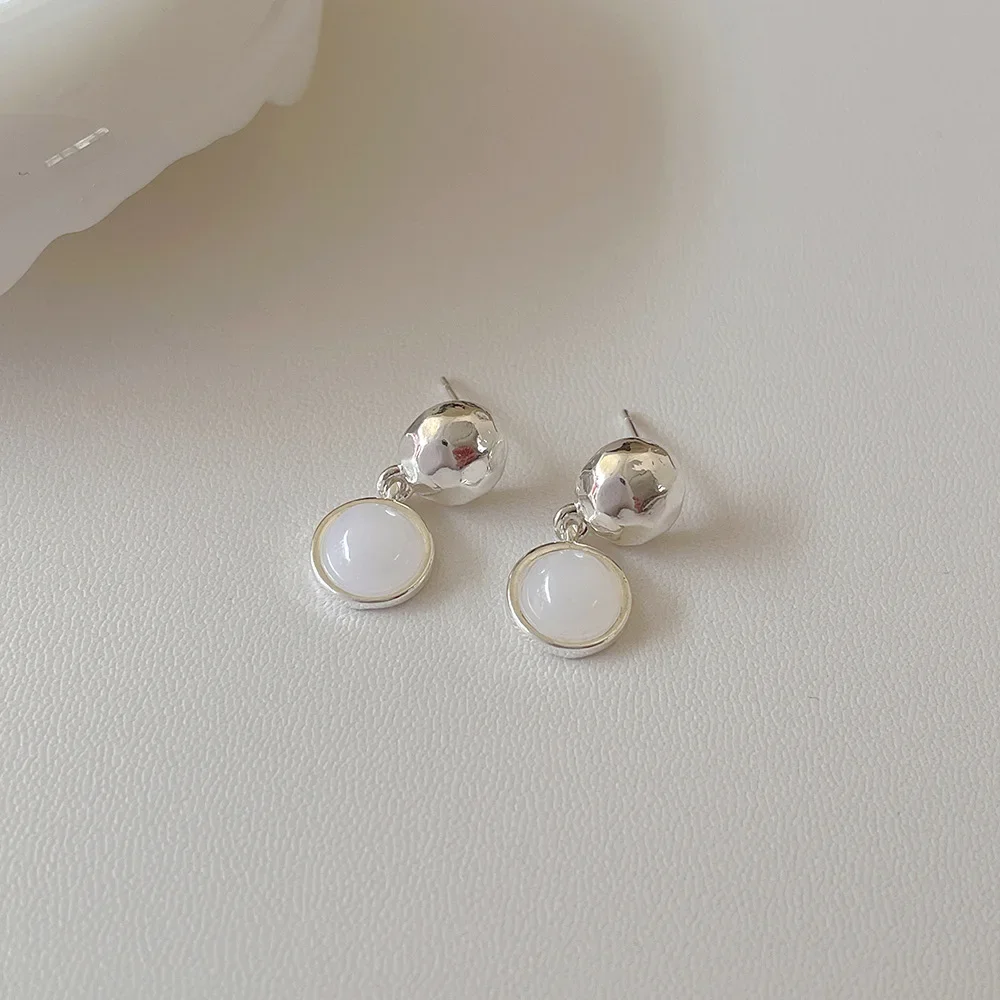 Нишевые дизайнерские круглые металлические серьги-подвески женские из серебра