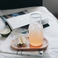 one person drinking teapot with single cup and wooden tray heat resistant glass jug for water tea juice work from home