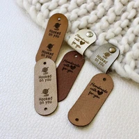 40pcs custom leather tags for knitted goods handmade labels for clothes crochet with rivets sewing label personalised brand logo