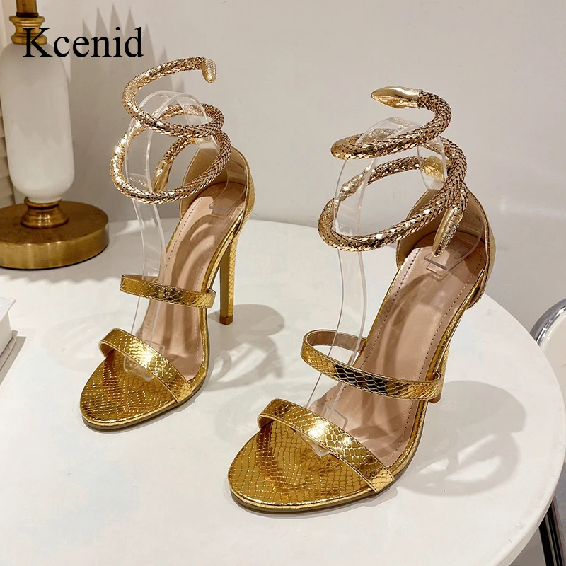 Kcenid модные золотые высокие каблуки Змеиный узор обмотки сандалии летние ремешки
