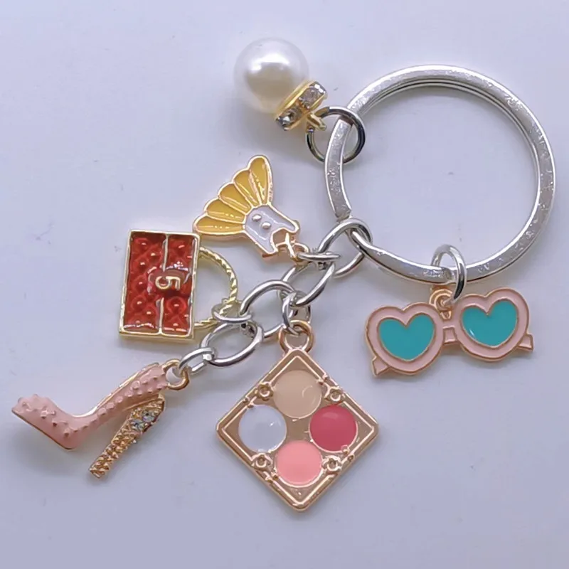 Новый брелок-подвеска Шарм Восхитительная мода Стразы Высокие каблуки Сумка Юбка Косметический чехол Очки Аксессуары Дамские украшения.