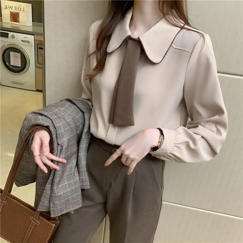 

Stylish Lapel Button Spliced Loose Lace Up Korean Shirt Female Clothing 2023 Spring New Casual Tops All-match Office Lady Blouse