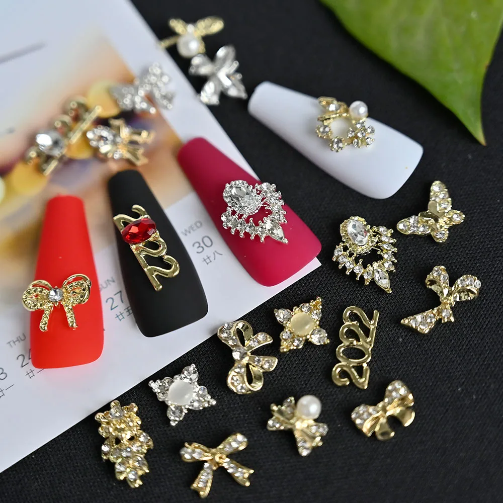 

10Pcs/Bag 3D Metal Ribbon Butterfly Nail Art Decoration Luxury Zircon Alloy Charms 2022 New Design DIY Manicure Accessories OI-3