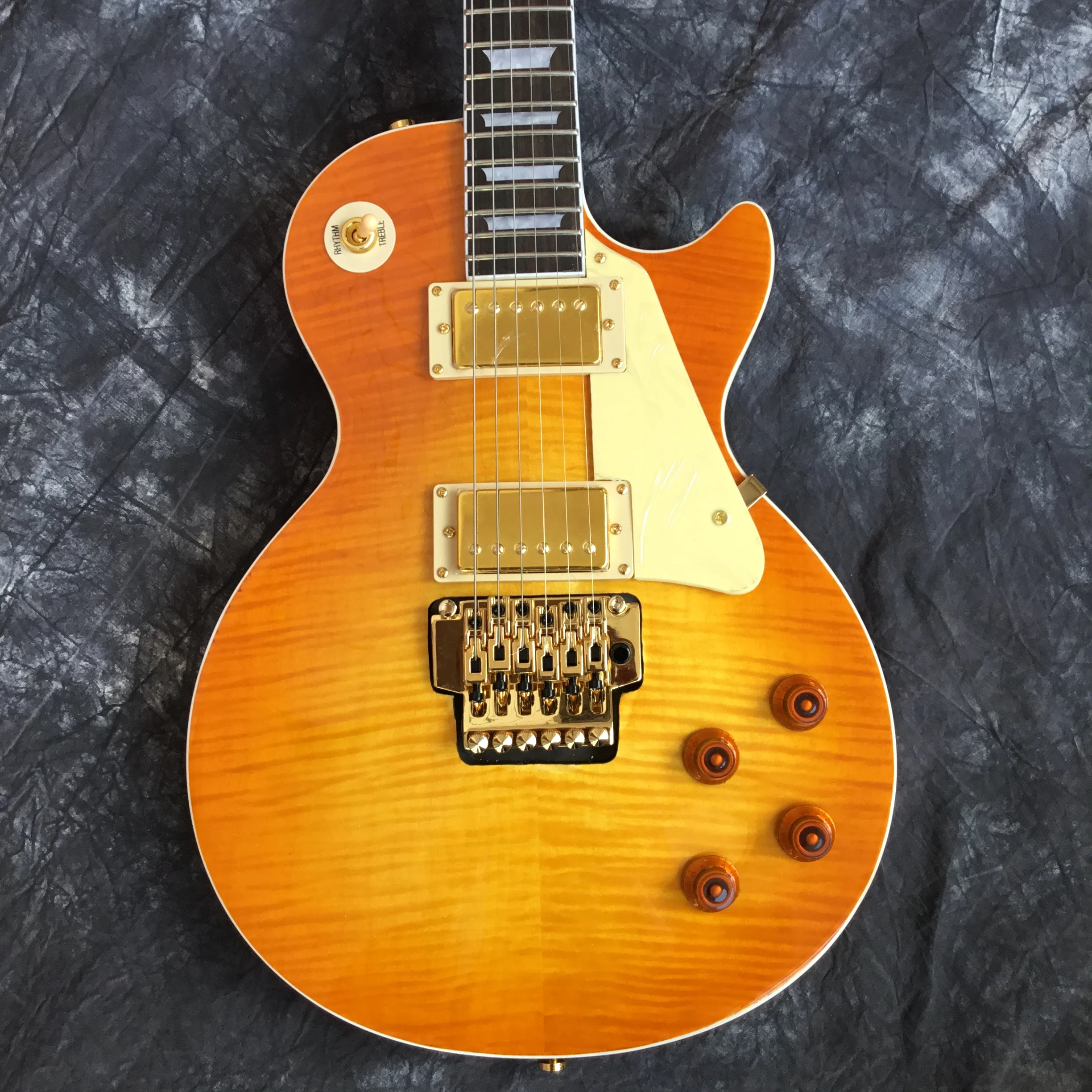 

wholesale and retail new golden vibrato guitar electric guitar high quality good sound quality free shipping