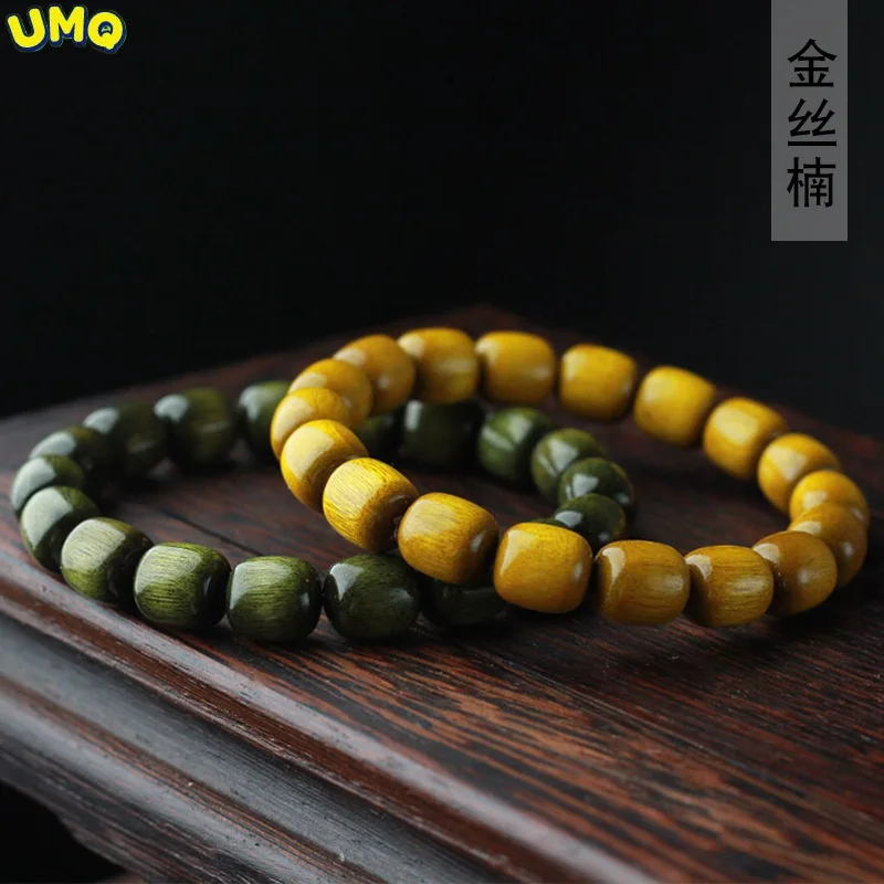 

Gold Silk Nanmu Jujube Beads Lovers' Hand String 1.0 * 18 Yellow and Green Stationery Beads Decorative Jewelry