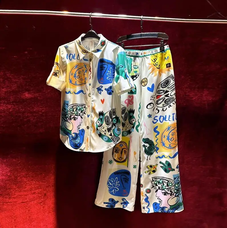 

Женская одежда в европейском и американском стиле, Новинка лета 2023, рубашка с мультяшным принтом и отложным воротником, модный костюм с широкими штанинами и короткими рукавами