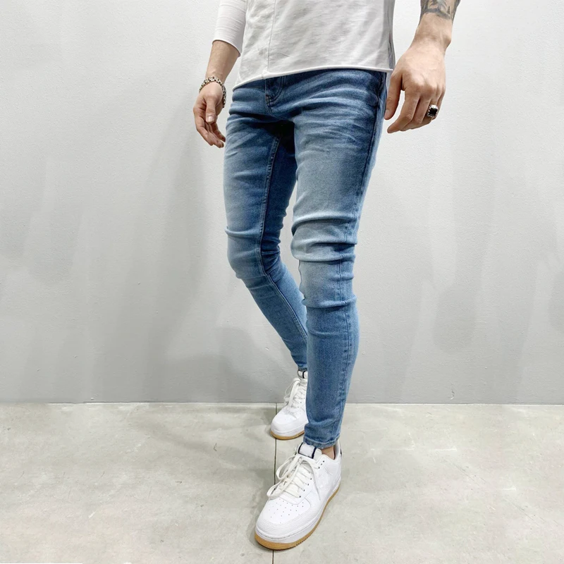 Europe and the United States new wish men's pants ripped white loose denim trousers fashion pencil pants Stylish casual jeans