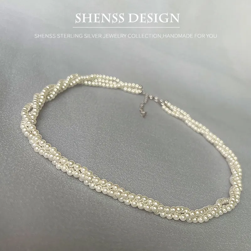 

Elegant Three Layer Shell Pearl Necklace
