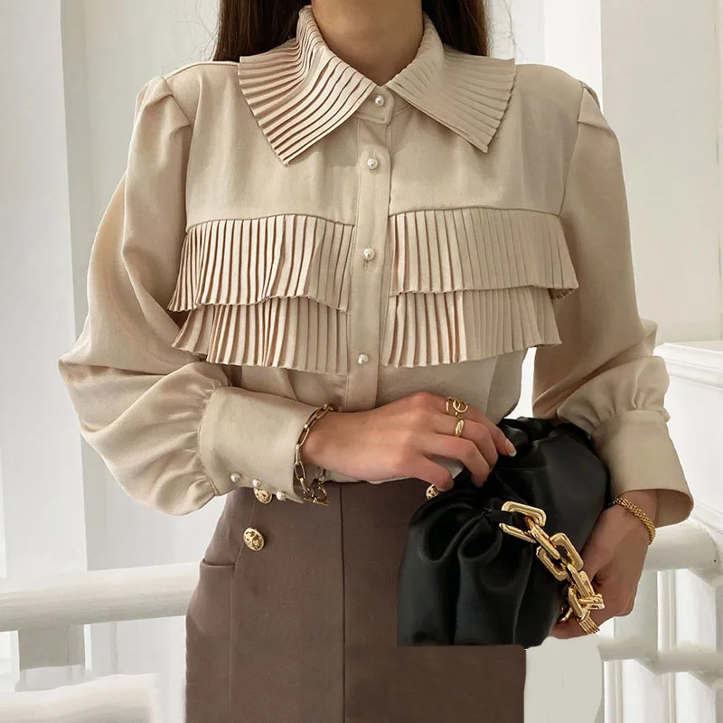 

ZCSMLL Korean spring French temperament lapel organ side stitching chic single-breasted puff sleeve shirt top women