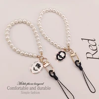 mobile phone lanyard short pearl hanging chain rose pendant pendant handmade wrist strap phone shell anti lost landyard key