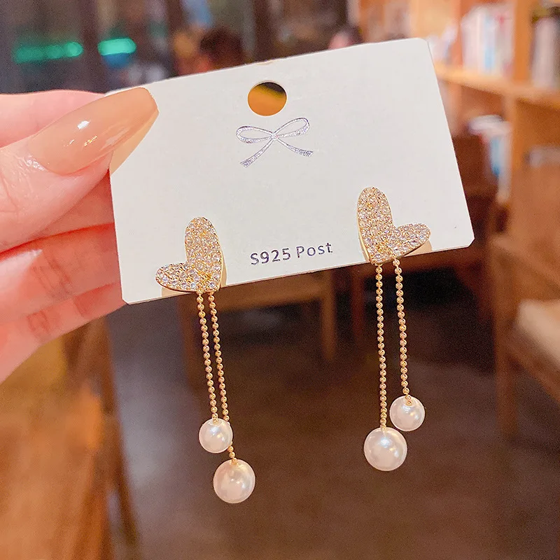 

Silver Needle South Korea's New Long Tassel Pearl Earrings Women Delicate and Versatile Love Stud Earrings for Women