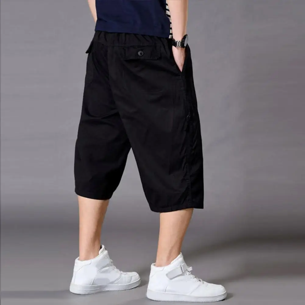 

Дышащие мужские летние укороченные брюки длиной до середины икры с эластичным поясом и несколькими карманами для спорта