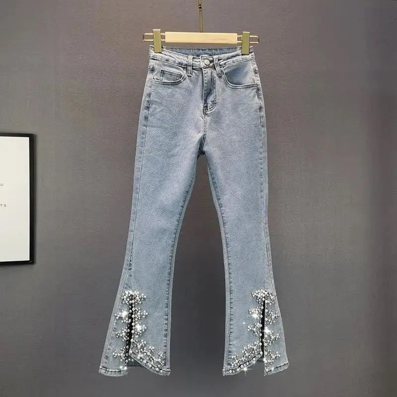 

Spring and summer new beaded split micro-bold jeans 2023 Korean version of high waist slim Joker tight bell bottoms female tide.