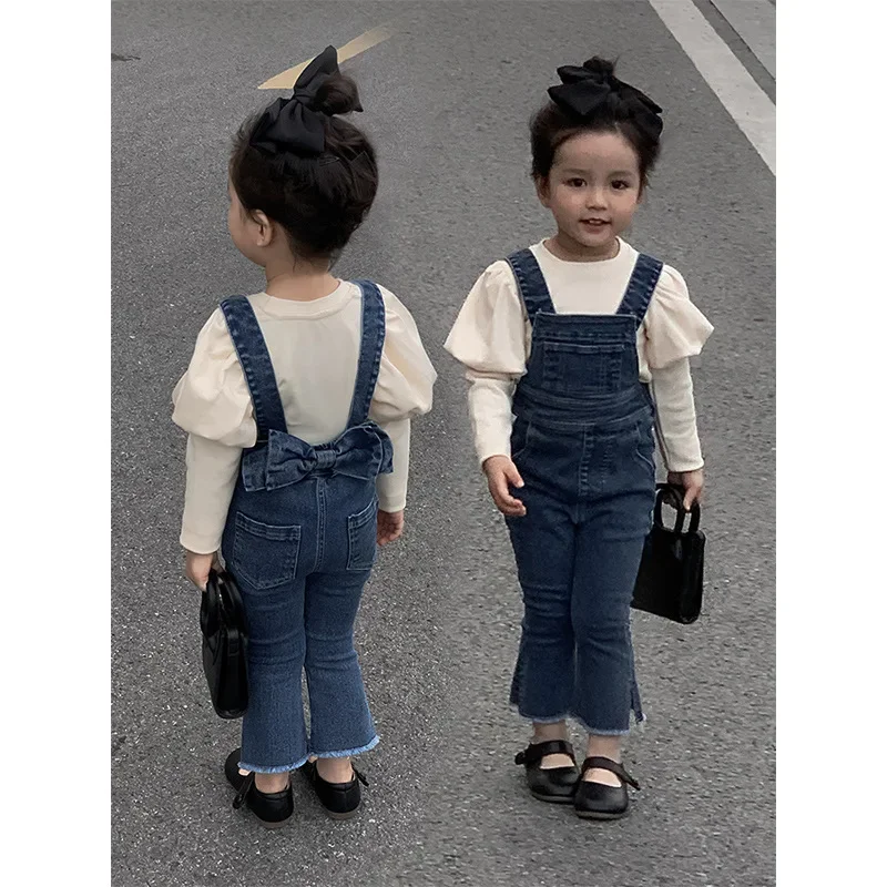 

Korean Style Autumn Kids Overalls Blue Sleeveless Jeans with Side Pockets Bowknot Decorated Pants Wide Leg Trousers