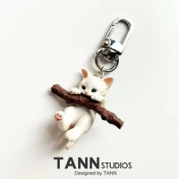 cute twig cat key chains simple cartoon corgi accessories for earphones airpods animal metal chram keychain for girls bag