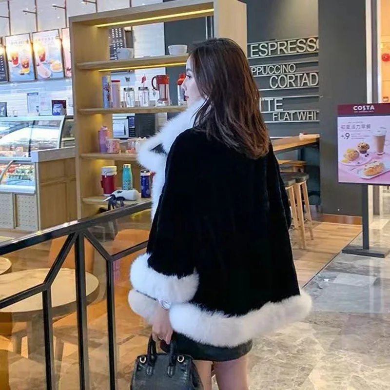 2022 autumn and winter new loose imitation fur black and white stitching warm air fashion all-match cape coat women