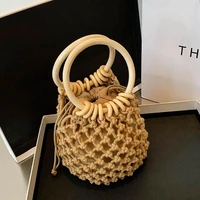 handwoven casual straw bag ladies woven beach bag wooden handle drawstring tote high quality hollow woven bag