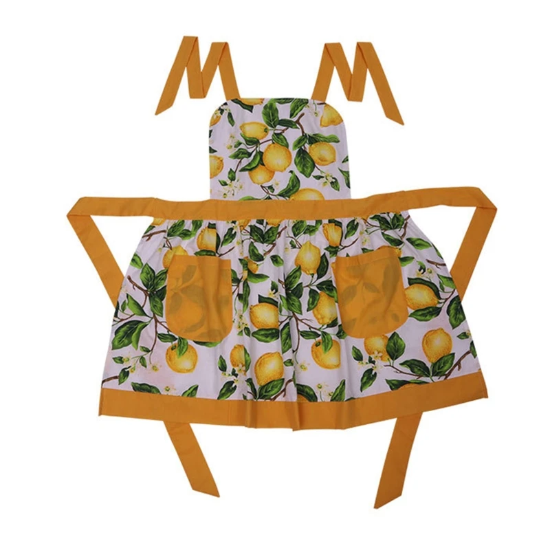 Кухонный фартук с зелеными листьями и лимоном карманами без рукавов висящий на