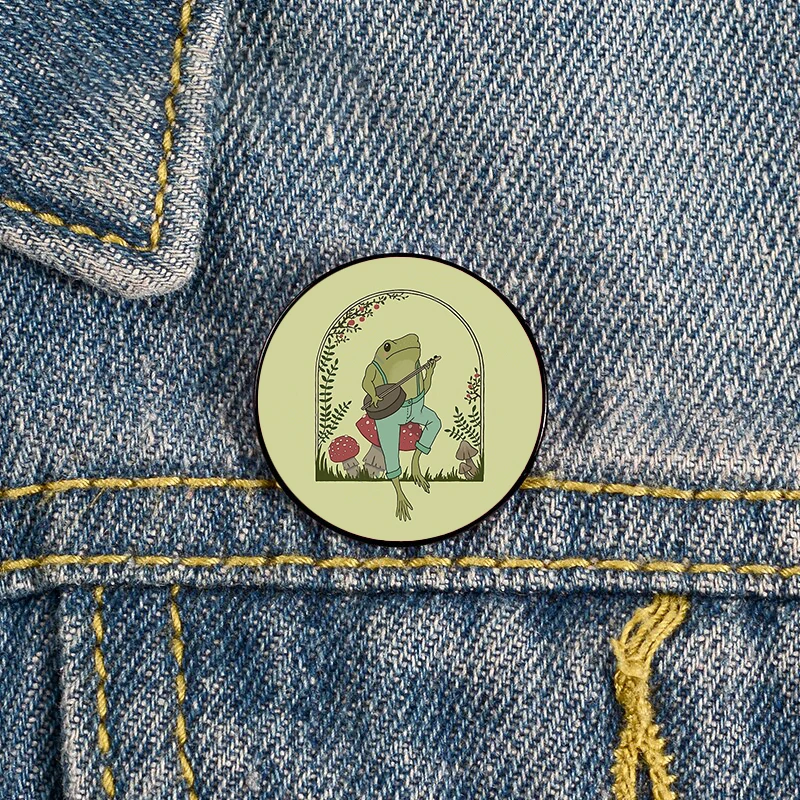

Ic Frog Playing Banjo on Mushroom Pin Custom Funny vintage Brooches Shirt Lapel teacher Bag Badge pins for Lover Girl Friends