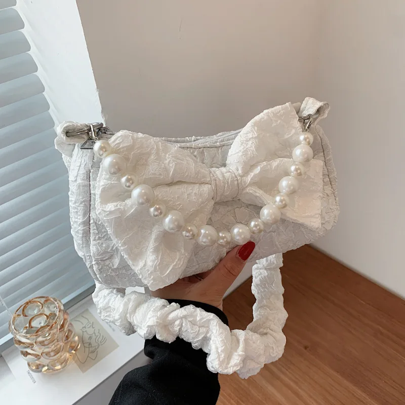 

Женская дизайнерская сумка через плечо с жемчугом и бантом