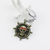 one piece keychain anime figure monkey d luffy straw hat skull rudder emblem rotatable alloy key chains keyring accessories gift