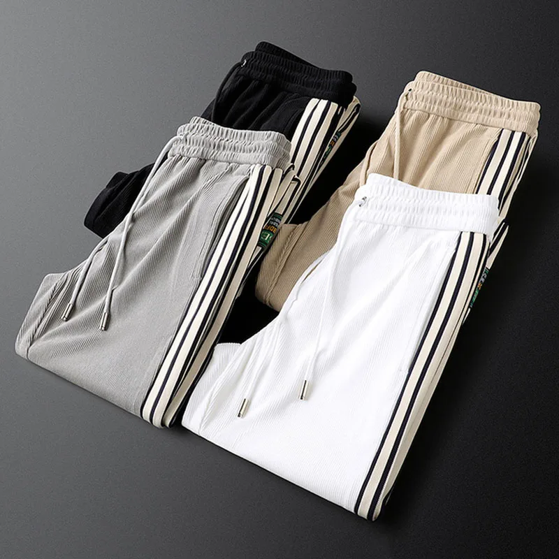 

Light luxury webbing casual sports pants men's autumn and winter knitted men's sweatpants strip velvet leggings men's pants