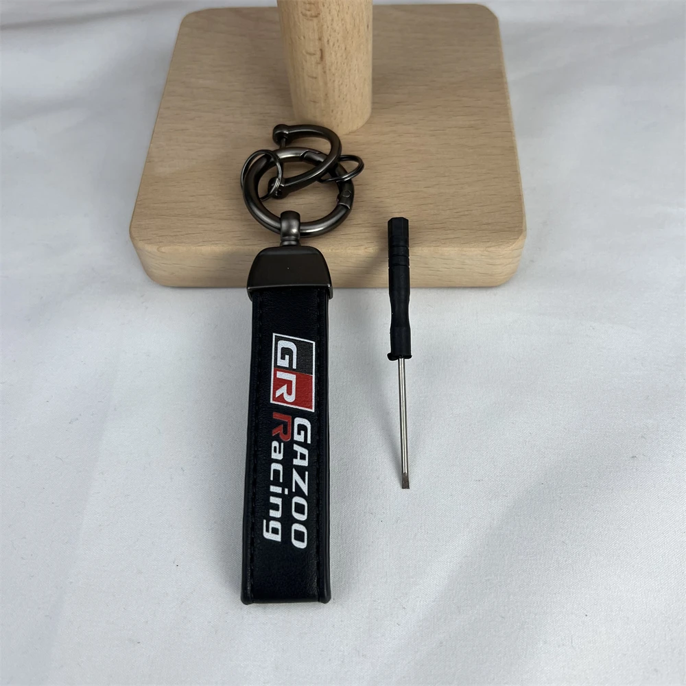 

Car Keychain Contains 1 Screwdriver Alloy Leather Metal Lock Key Ring Black Classic Emblem Logo For Gazoo Racing GR Accessories