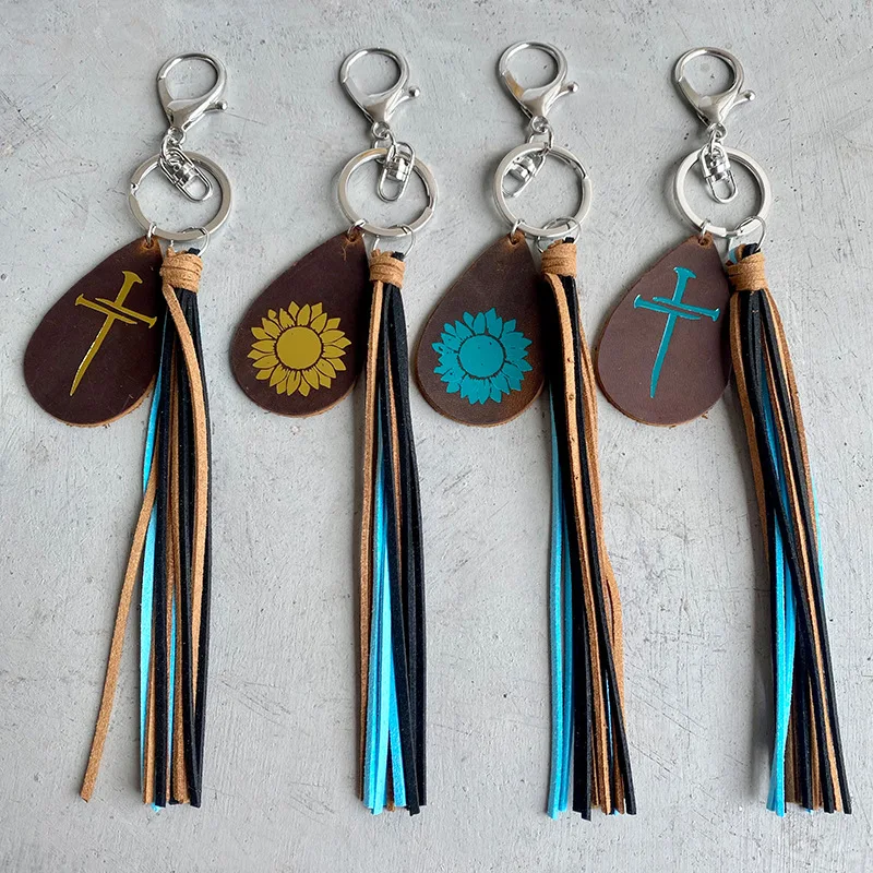 

2022 Wholesale Horse Leather Keychain Texture Bronzing Sunflower Cross Drop-shaped Key Ring Leather Tassel Pendant Key Chains