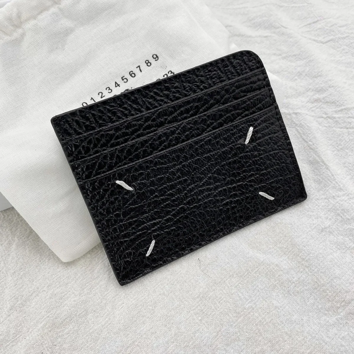 

New Cowhide Four Corner Sewing Mark Men's and Women's Simple Black LOGO Fashion Card Bag Texture Zero Wallet