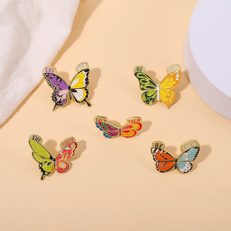 

Creative Butterfly Grammar Lapel Pins SHE HER THEY THEM HE HIM Pronoun Enamel Brooch Nice Insect Badge Jewelry Gift for Friends