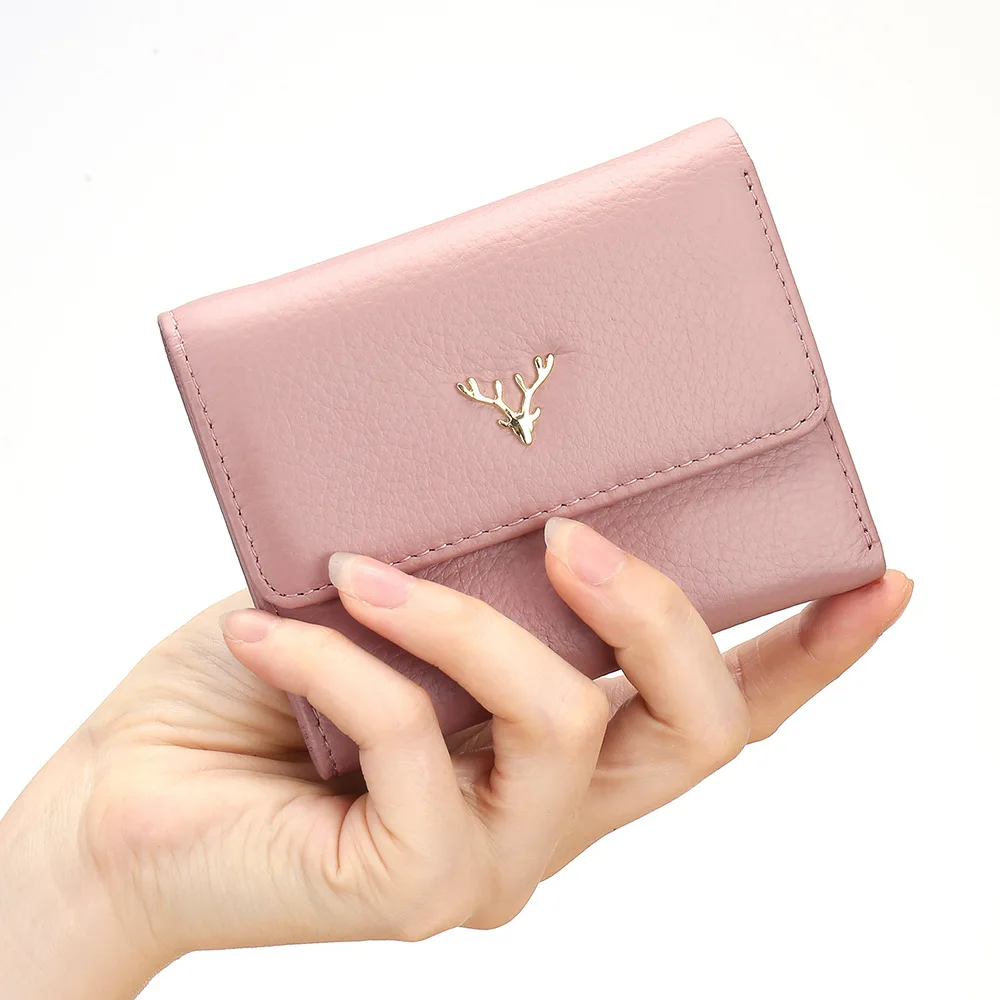 2022 new fashion short leather wallet women's three fold head layer cowhide simple small folding thin multi card position |