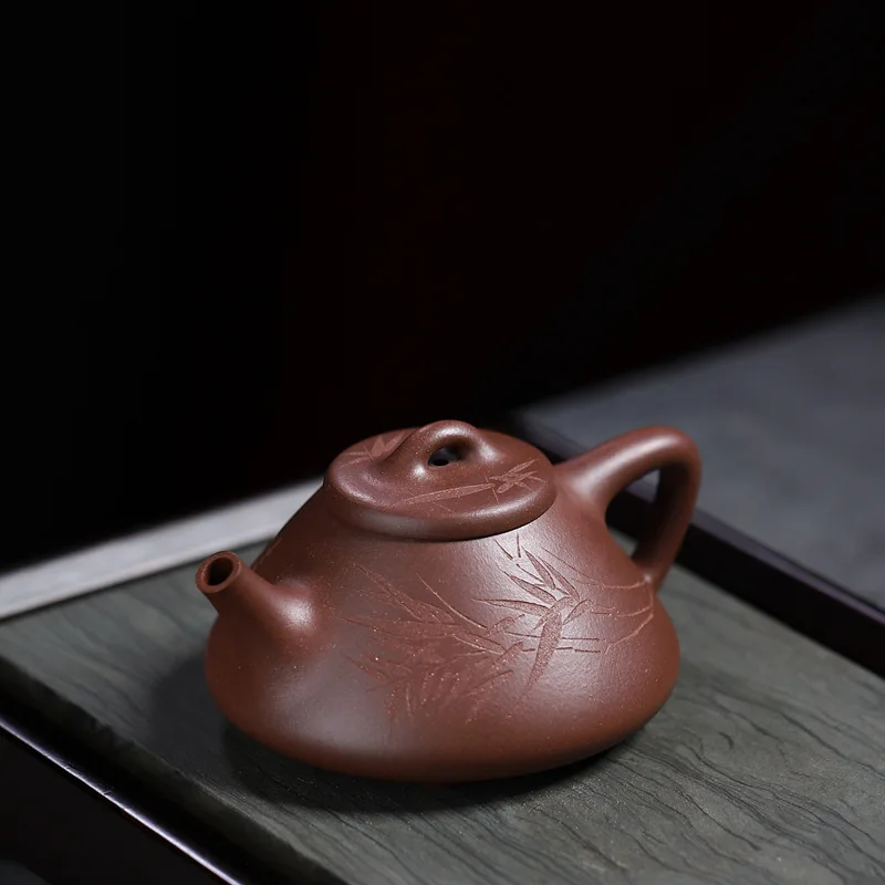 

Yixing Purple Clay Pot Wholesale Carved Bamboo Leaf Stone Ladle Raw Ore Purple Clay 260 Ml Household Teapot Tea Set