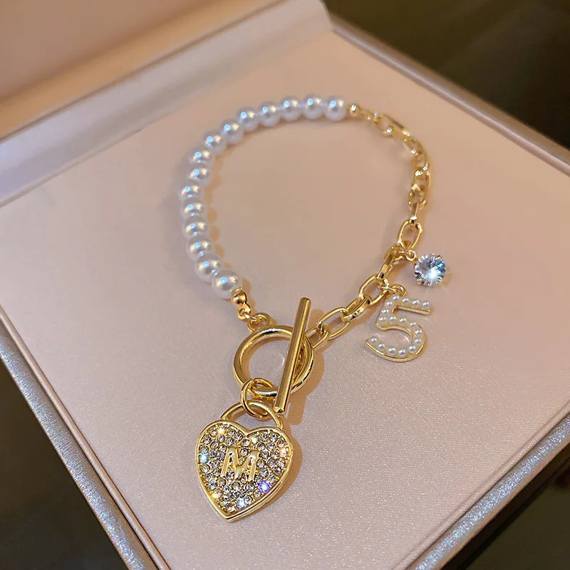 

2022 New Korean Fashion New Personality T-shaped Buckle Pearl Diamond Bracelet Net Red Temperament Design Jewelry